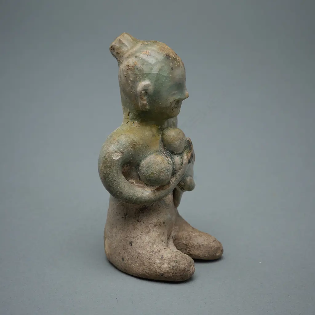 A Sawankhalok stoneware figure (tukatha), Image 1++